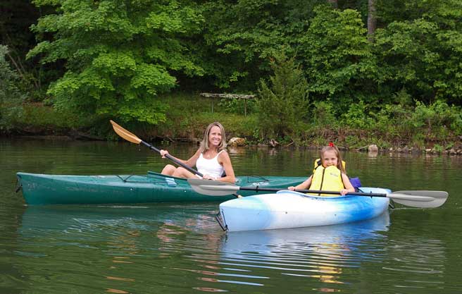 woman and girl canoeing
